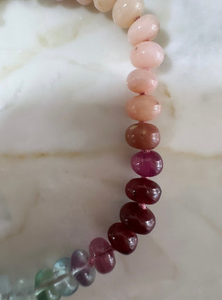 Sweeties Bracelet, mixed gemstones knotted on silk with an 18k gold clasp.