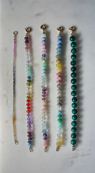Tropical Rainbow bracelet, mixed gemstones knotted on silk with an 18k gold bolt ring clasp.