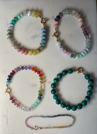 Tropical Rainbow bracelet, mixed gemstones knotted on silk with an 18k gold bolt ring clasp.