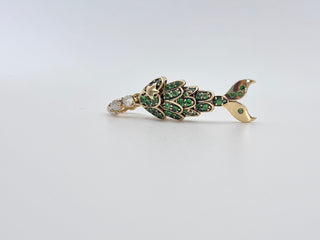 Tsavorite Mermaid Tail Charm by Sorsa Jewellery, green tsavorite scales set in blackened 9k gold with a moonstone bail.