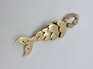 Tsavorite Mermaid Tail Charm by Sorsa Jewellery, green tsavorite scales set in blackened 9k gold with a moonstone bail.