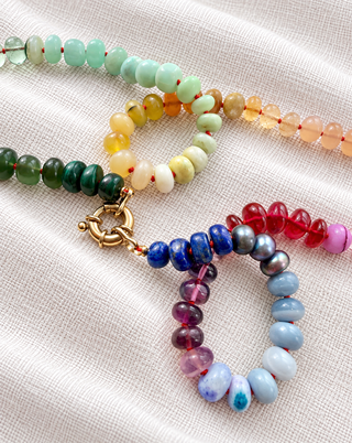 Victoria Park Rainbow Gemstone Necklace, designed in collaboration with Laura Coleman, hand-knotted rainbow gemstones with a solid 9k gold clasp.