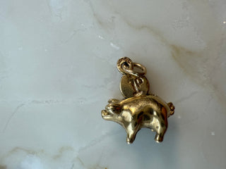 Vintage 9ct gold piggy bank charm with a tiny moveable 1p coin.