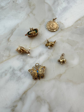 Vintage 9ct gold piggy bank charm with a tiny moveable 1p coin.