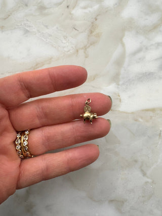 Vintage 9ct gold piggy bank charm with a tiny moveable 1p coin.