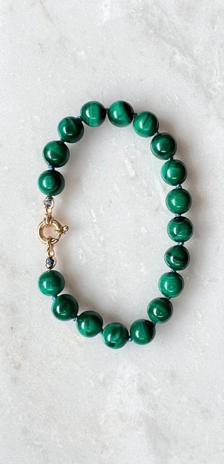 X-Large Malachite bracelet, malachite beads knotted on silk with an 18k gold bolt ring clasp.