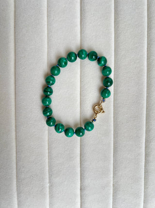 X-Large Malachite bracelet, malachite beads knotted on silk with an 18k gold bolt ring clasp.